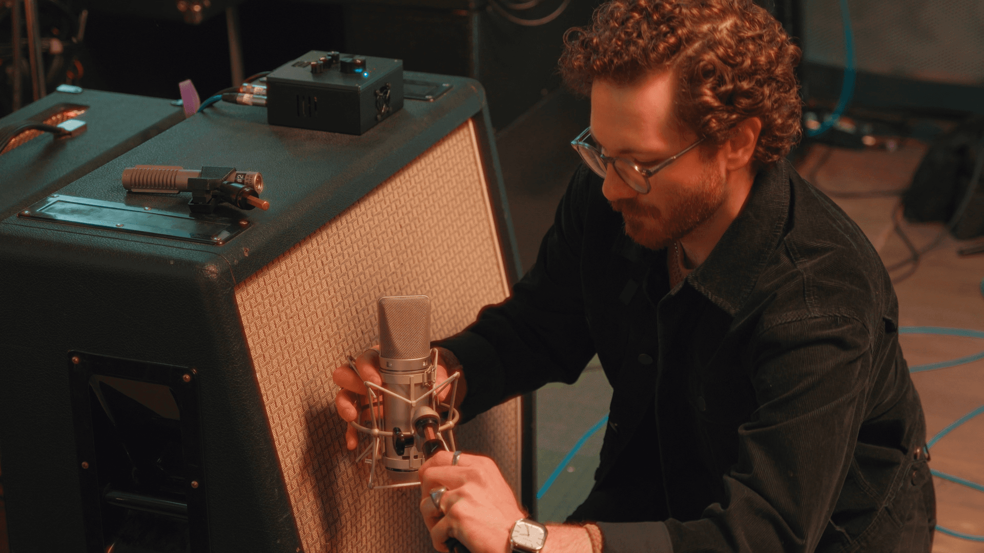 setting up mics in a recording studio