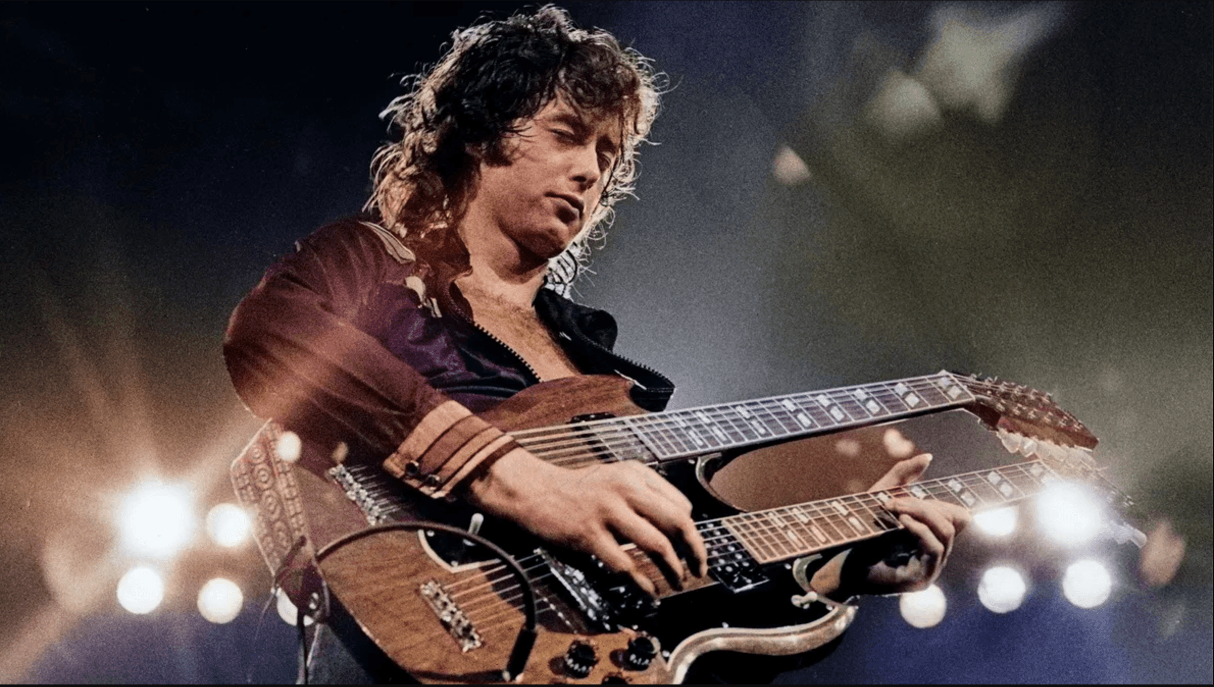 Jimmy Page playing a double neck guitar