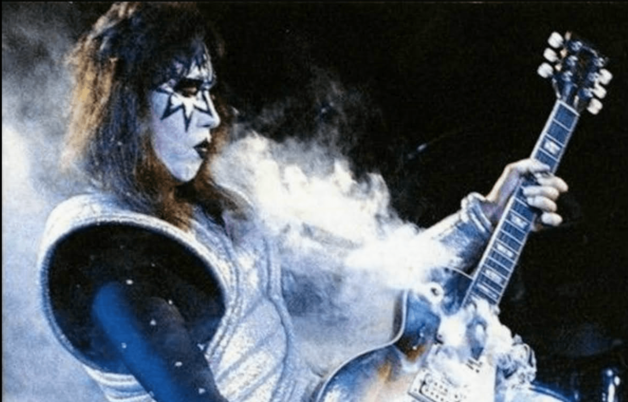 Ace Frehley playing guitar with KISS