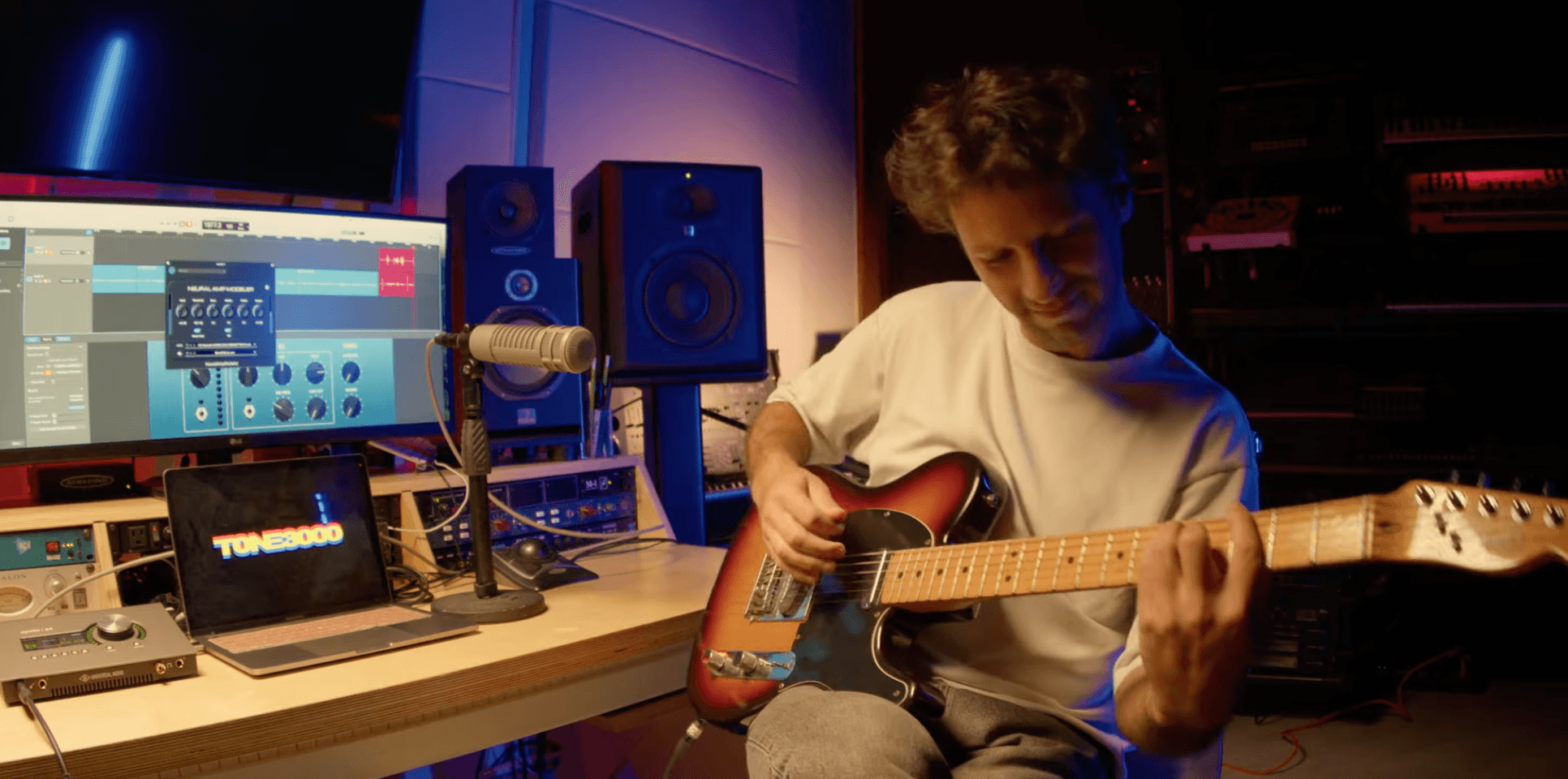 guitarist in front of a DAW