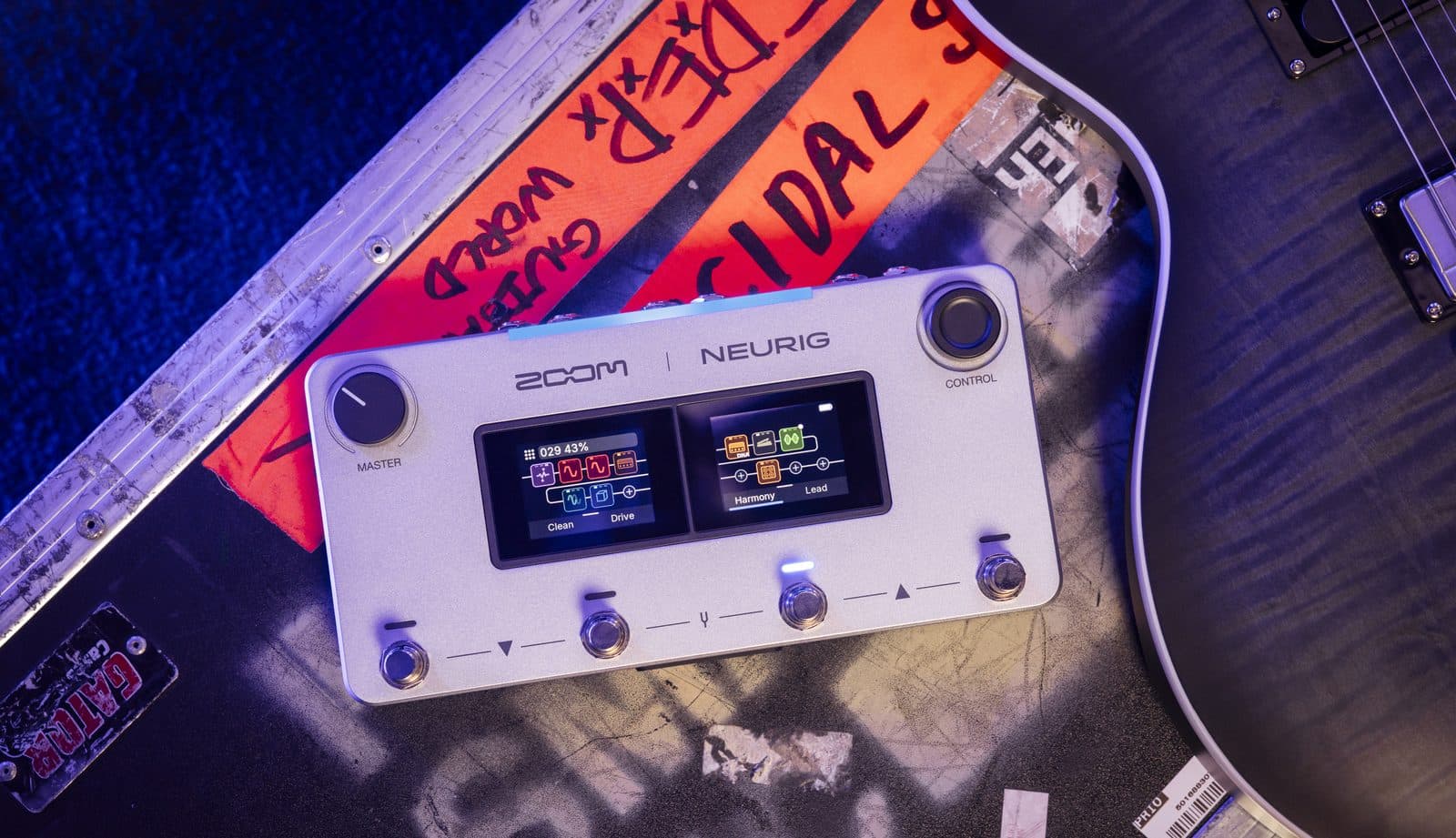 ZOOM NEURIG on a road case next to a guitar