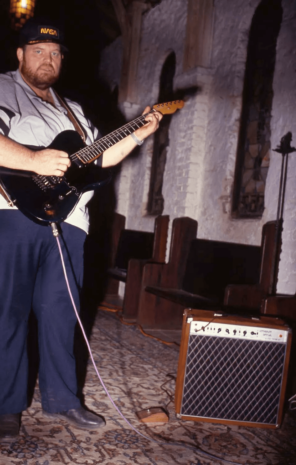 Alexander Dumble playing guitar